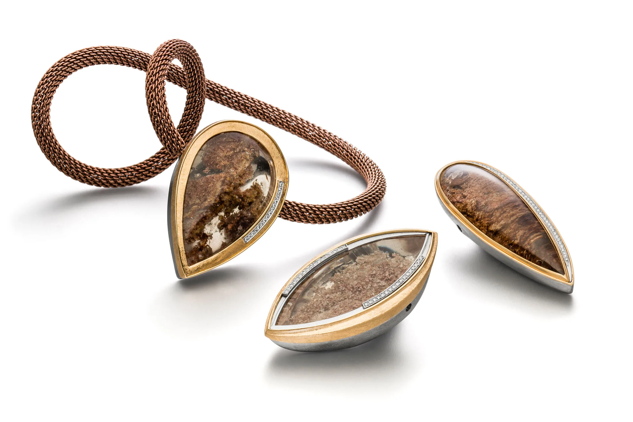 Brown mesh necklace with three interchangeable included quartz clasps